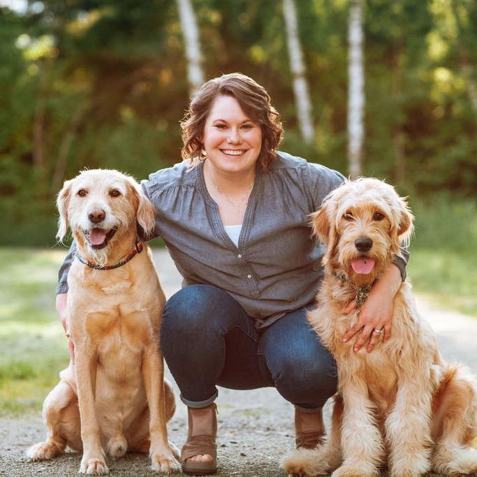 Women with two dogs